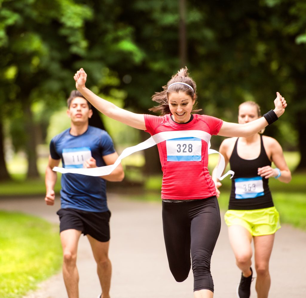 woman crossing finish line